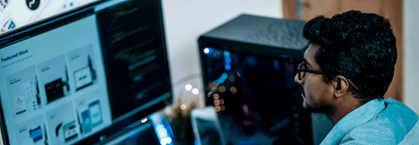 A man looking at a computer screen