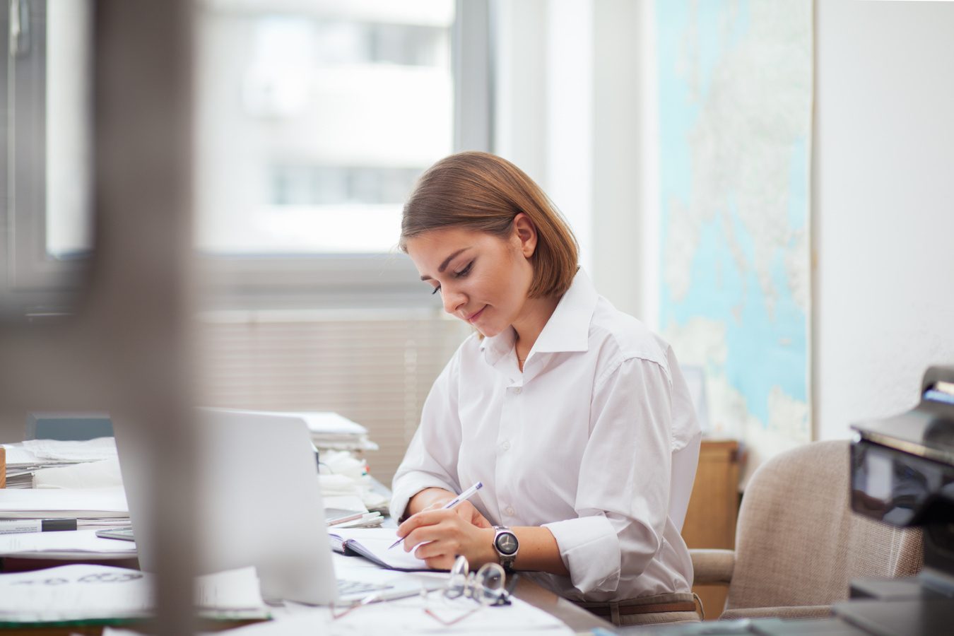 Young woman working on laptop at office